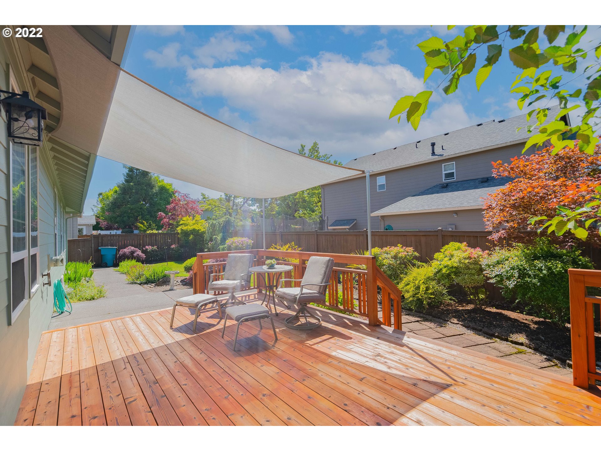 3711 Northwest 114th Street Vancouver, WA 98685 - Photo 27 of 32 a view of a patio with table and chairs potted plants with wooden floor