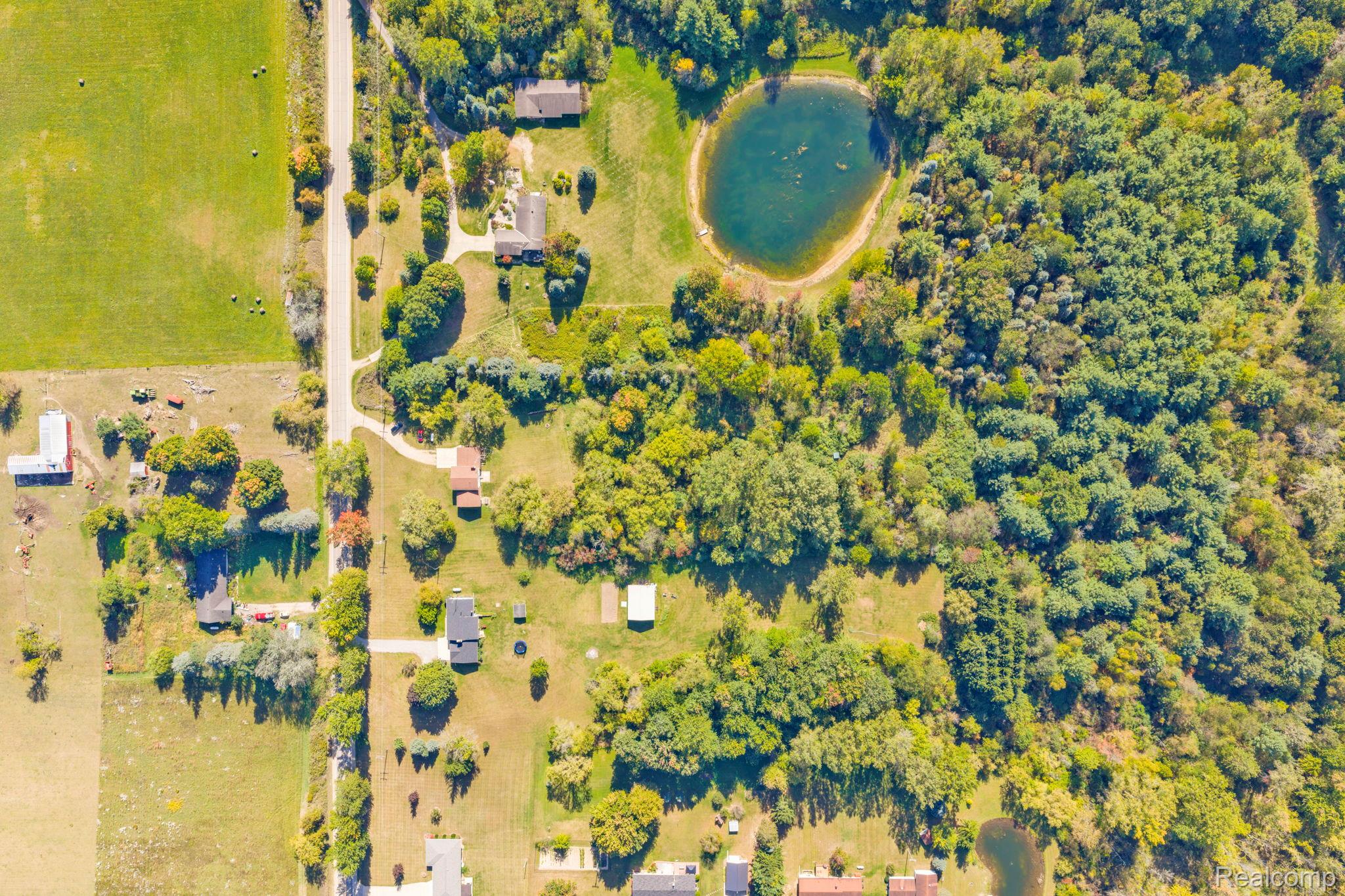 3052 South Kingston Road Kingston, MI 48741 - Photo 5 of 51 Aerial view of property and surrounding area with a nearby body of water