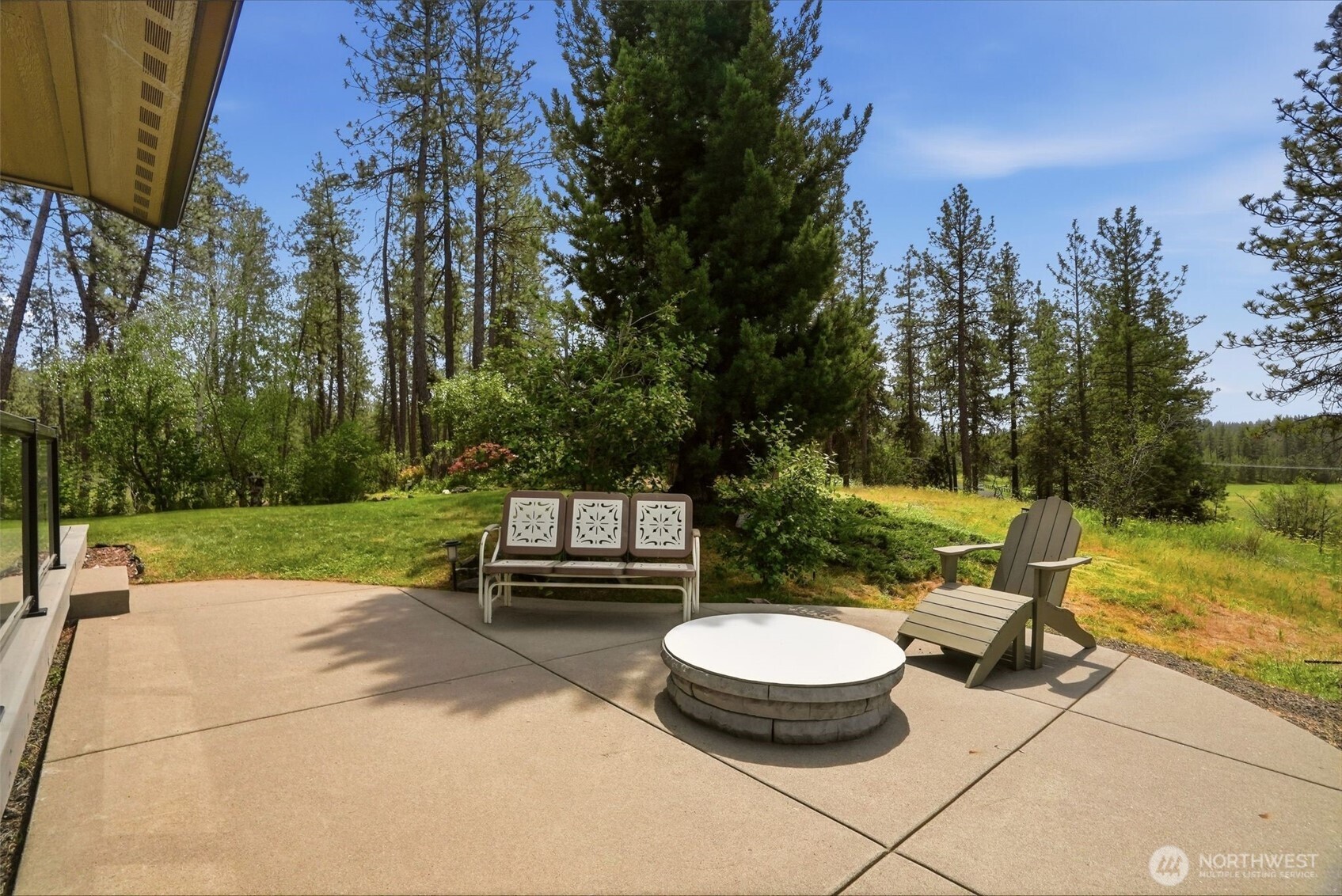 12119 South Spotted Road Cheney, WA 99004 - Photo 28 of 40 a view of a swimming pool with a patio