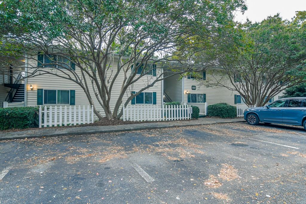 a view of a yard with a large trees and a small yard