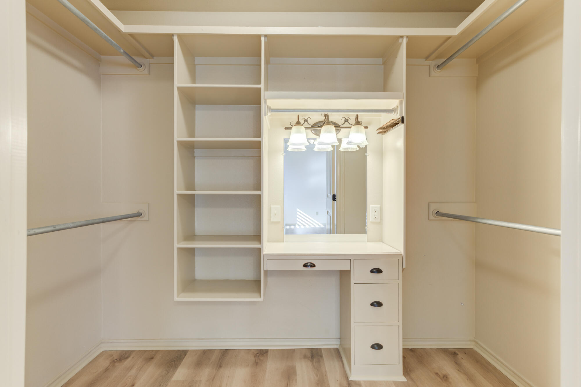 6509 72nd Street Lubbock, TX 79424 - Photo 19 of 40 a view of a bedroom with cabinet and windows