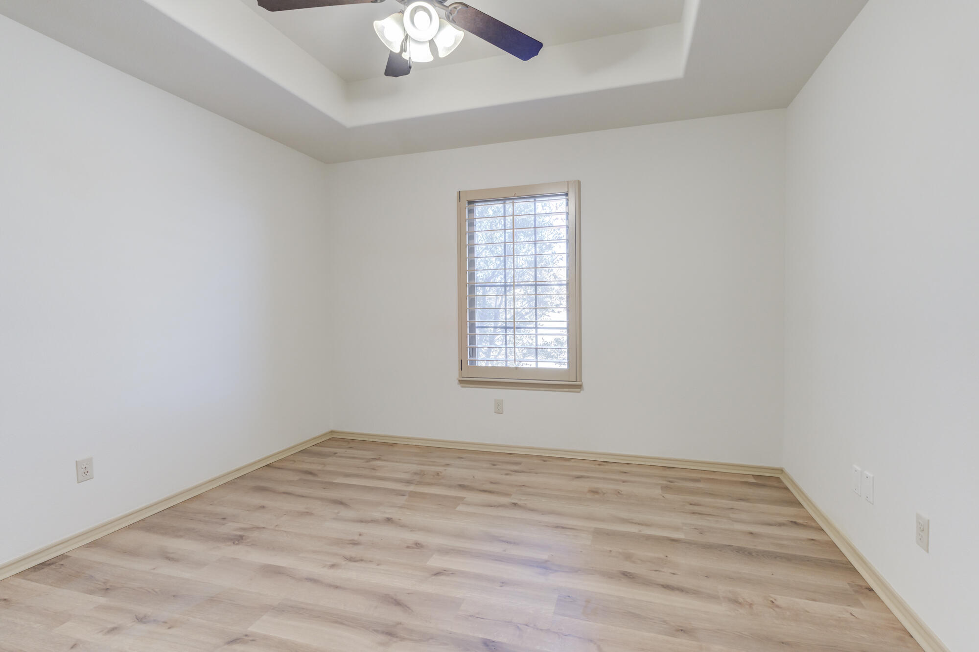 6509 72nd Street Lubbock, TX 79424 - Photo 26 of 40 wooden floor in an empty room with a window