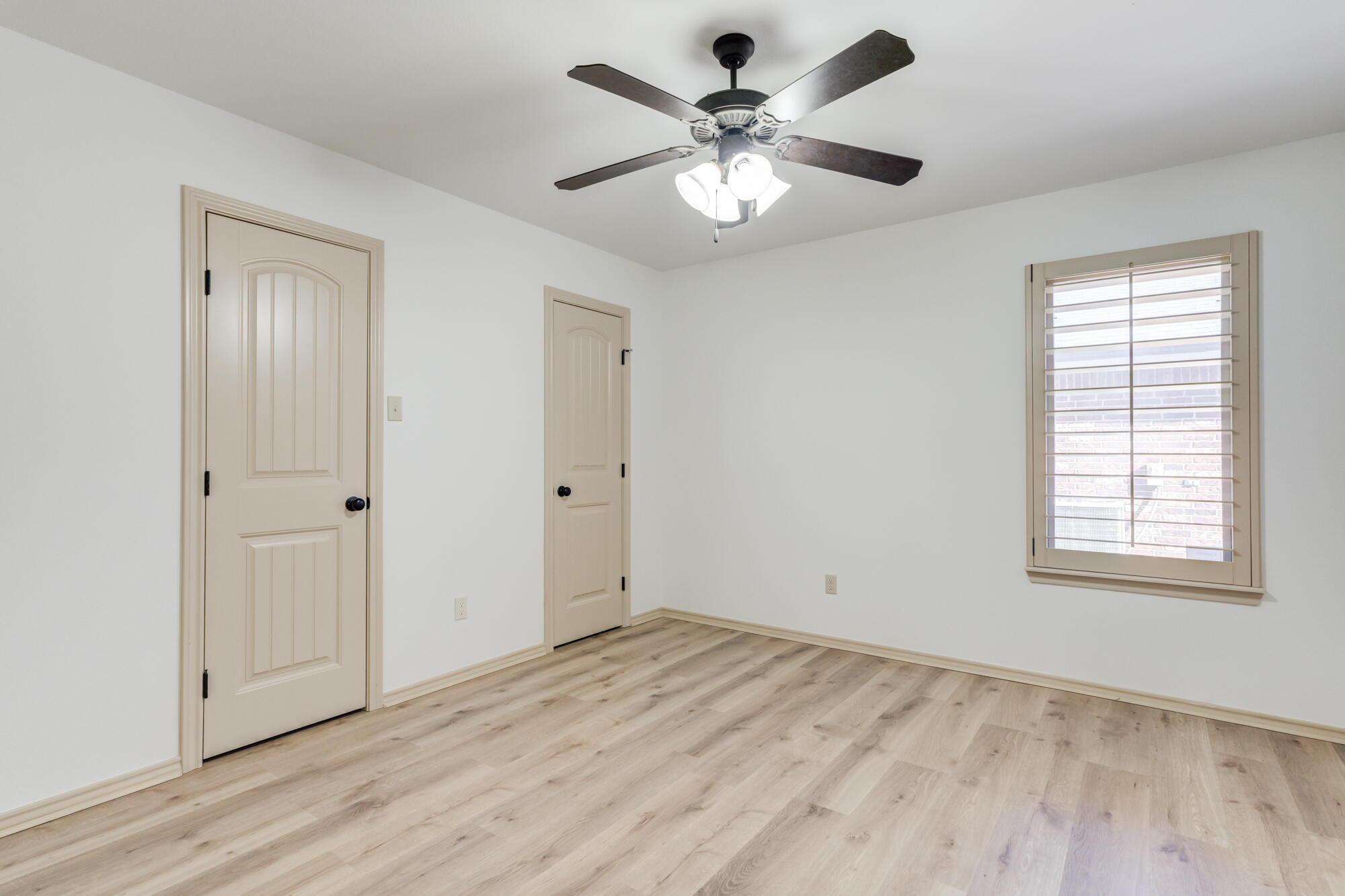 6509 72nd Street Lubbock, TX 79424 - Photo 30 of 40 a view of an empty room with wooden floor and a window