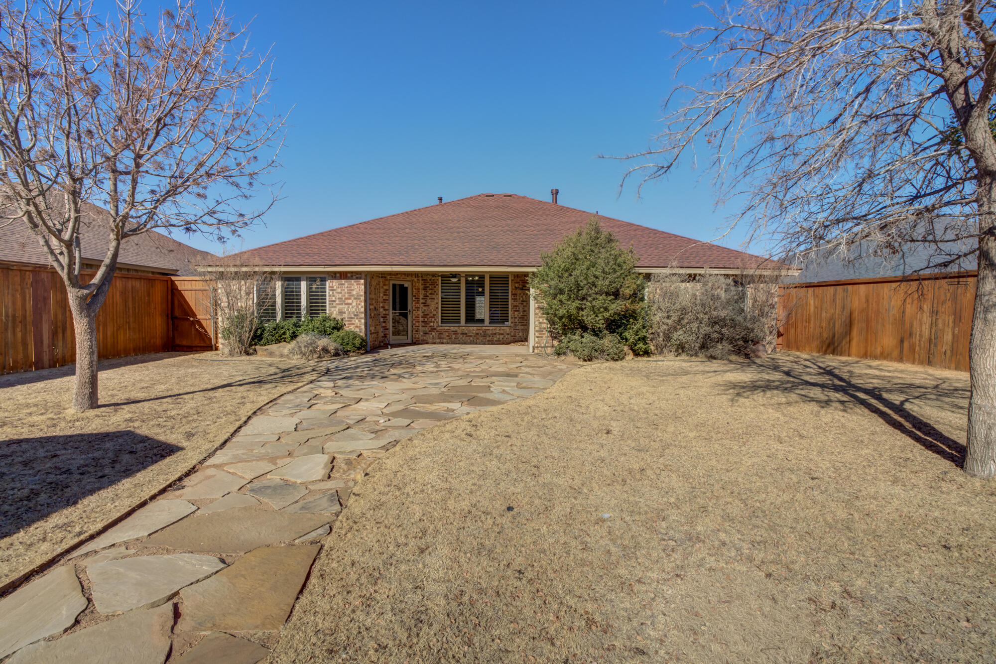 6509 72nd Street Lubbock, TX 79424 - Photo 38 of 40 a view of a house with a yard