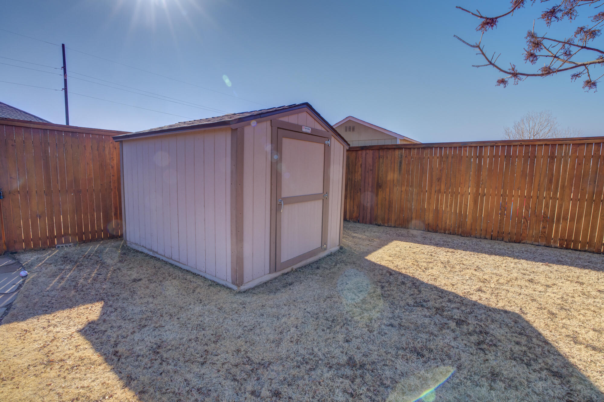 6509 72nd Street Lubbock, TX 79424 - Photo 39 of 40 a view of a room with cabinets and wooden floor
