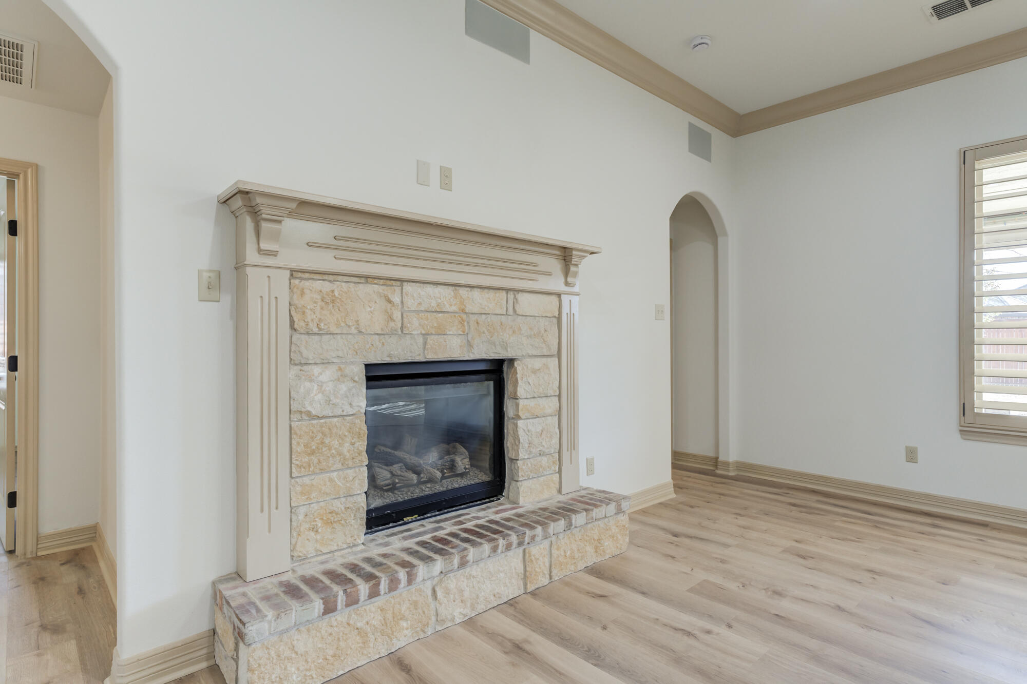6509 72nd Street Lubbock, TX 79424 - Photo 7 of 40 a living room with furniture and a fireplace