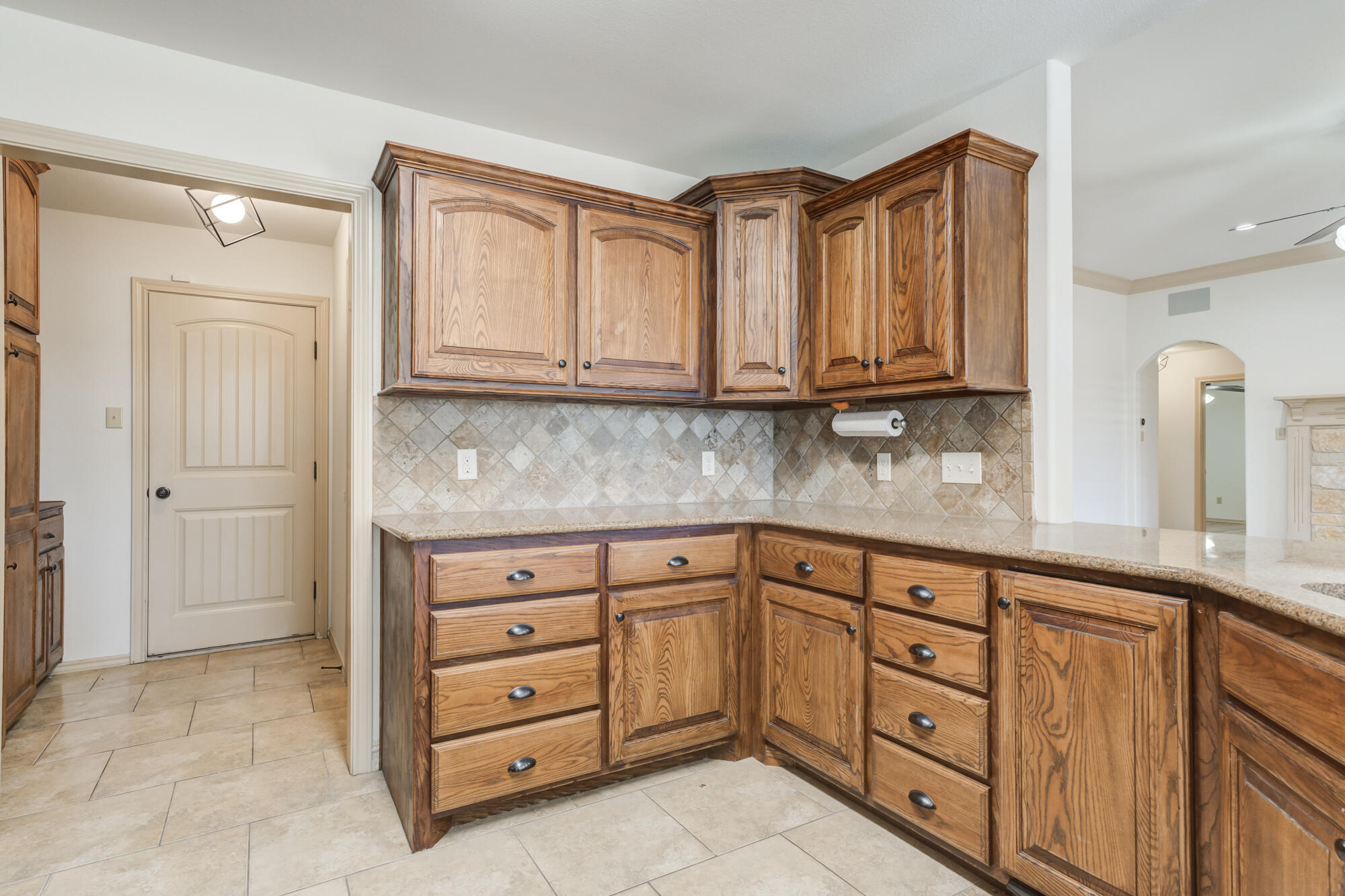 6509 72nd Street Lubbock, TX 79424 - Photo 10 of 40 a kitchen with cabinets appliances and a sink