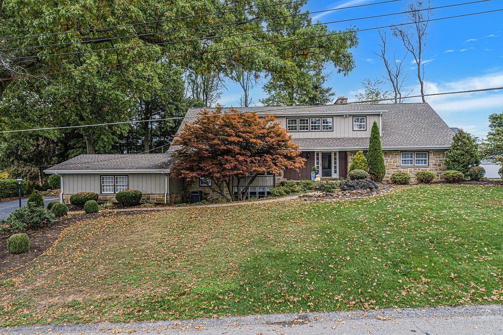 2 Davidson Drive Beaver Falls, PA 15010 - Photo 2 of 25 a front view of a house with garden