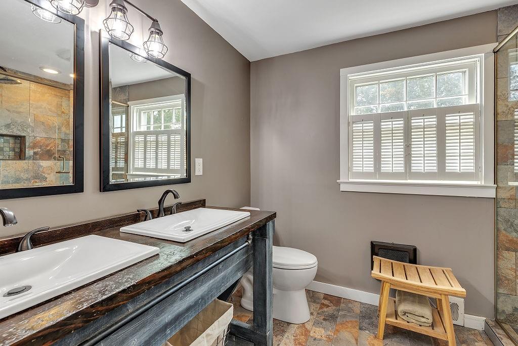 2 Davidson Drive Beaver Falls, PA 15010 - Photo 20 of 25 a bathroom with a granite countertop toilet a sink and a window