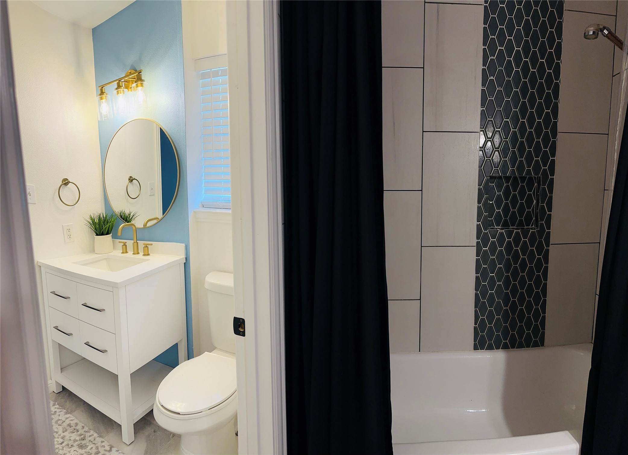 1457 Camellia Street Sweeny, TX 77480 - Photo 19 of 26 a bathroom with a sink a toilet and shower curtain