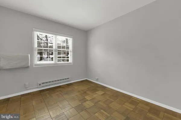 a view of empty room with windows