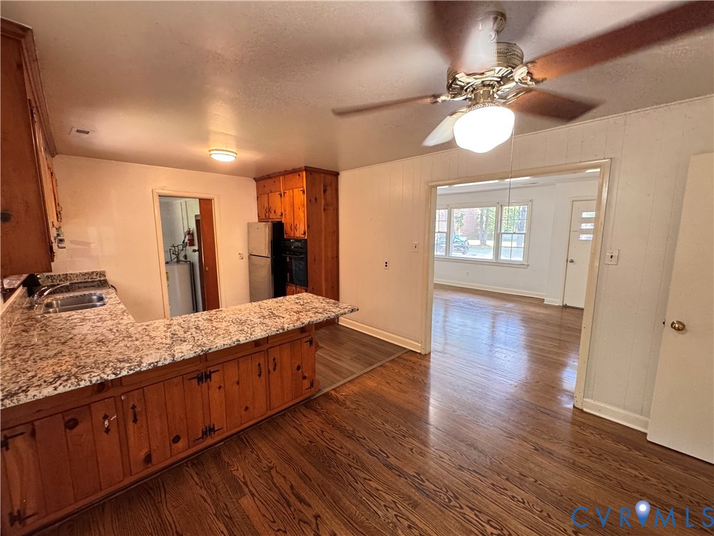 7019 Fairpines Road Richmond, VA 23234 - Photo 16 of 18 Kitchen area featuring wood-finish flooring, a bre