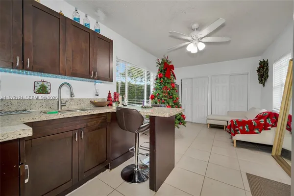 a kitchen with a sink cabinets and window