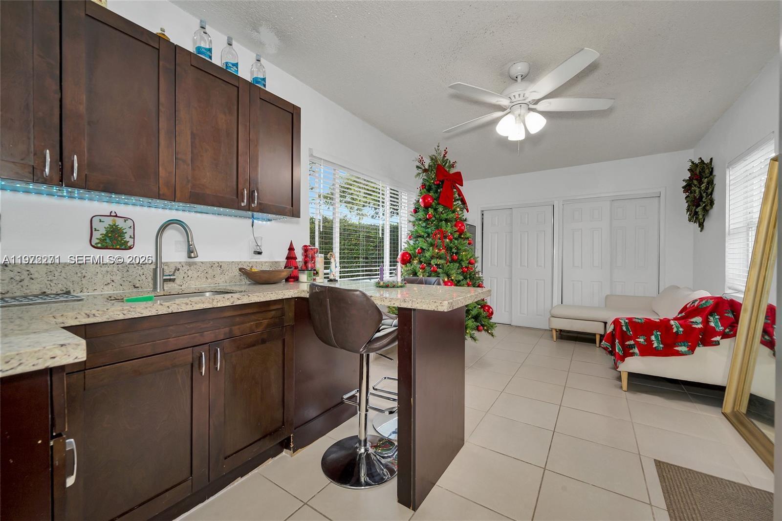 7420 Southwest 31st Street, Unit 2 Miami, FL 33155 - Photo 2 of 10 a kitchen with a sink cabinets and window