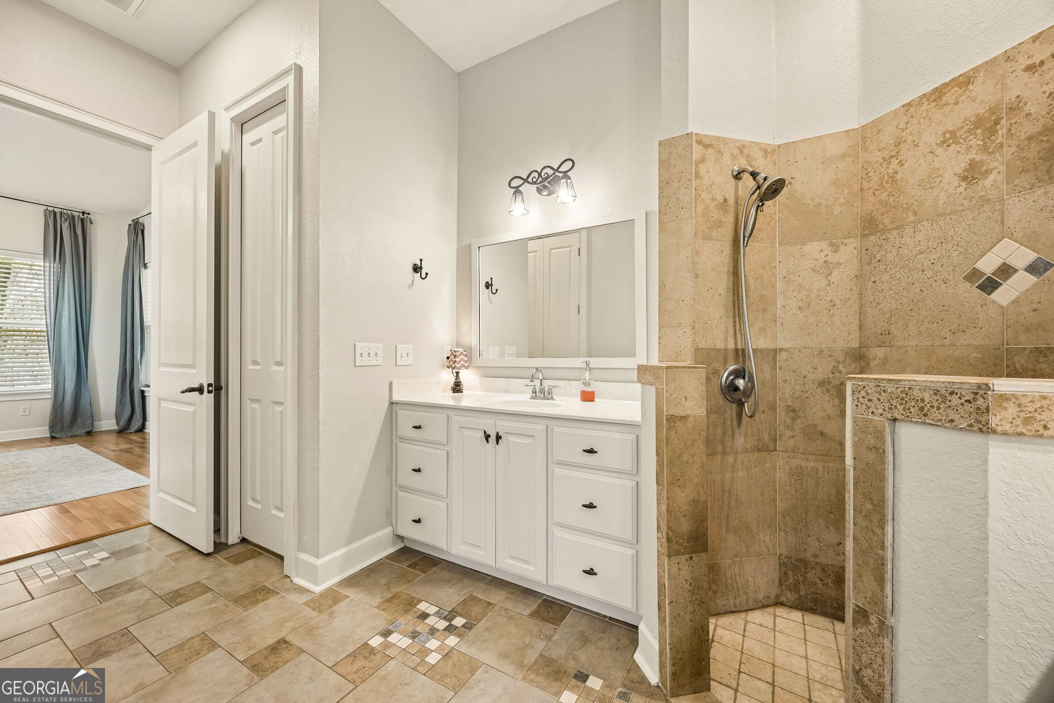 706 Hopewell Point Road White Oak, GA 31568 - Photo 36 of 84 The oversized walk-in shower features tile surround, elevated ceilings, and an open design for a luxurious daily experience.