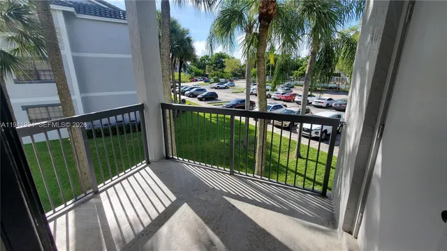 a view of a park with swings and slide
