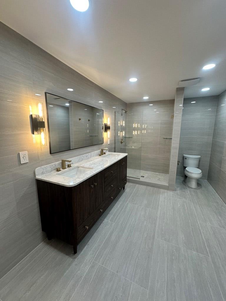 1432 22nd Street Columbus, GA 31901 - Photo 11 of 18 a spacious bathroom with a double vanity sink and a mirror