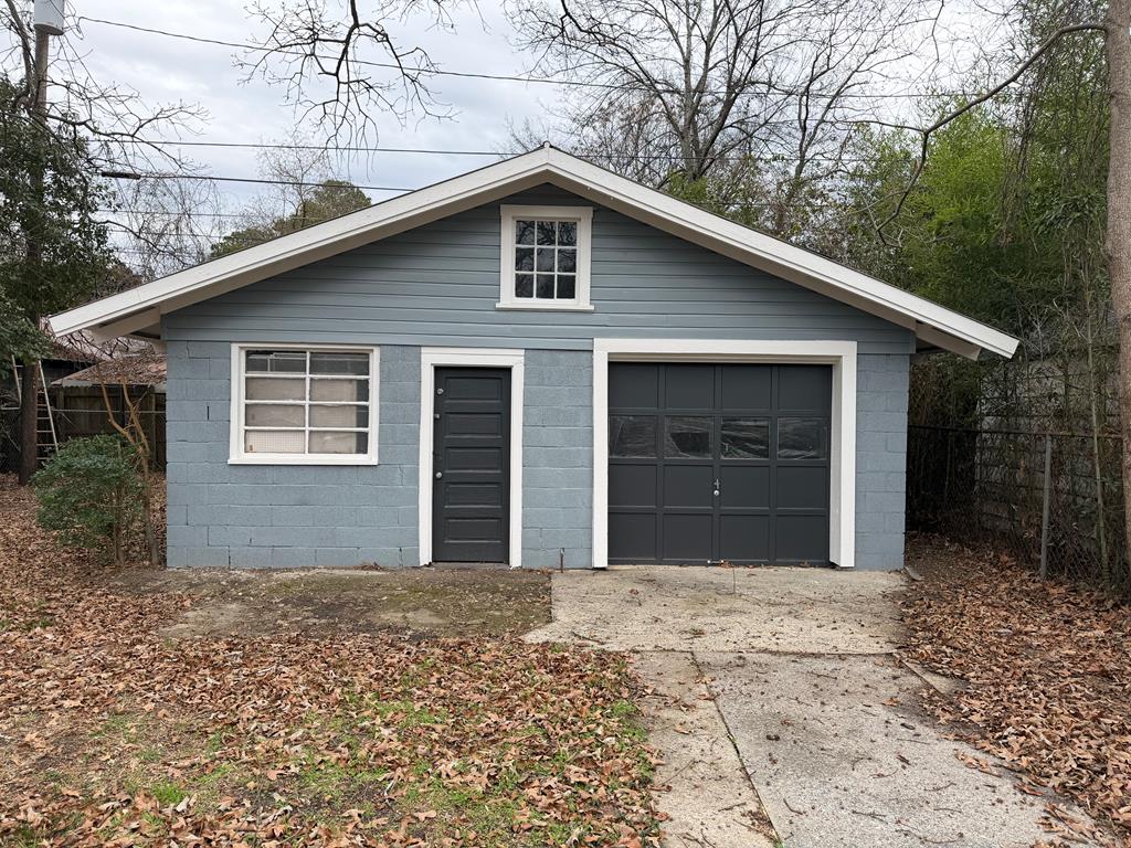 1432 22nd Street Columbus, GA 31901 - Photo 18 of 18 a front view of a house with a yard and garage