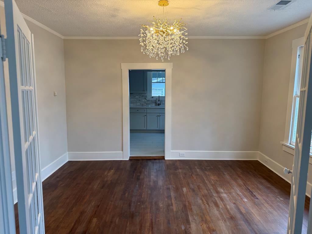 1432 22nd Street Columbus, GA 31901 - Photo 4 of 18 wooden floor in an empty room with a window