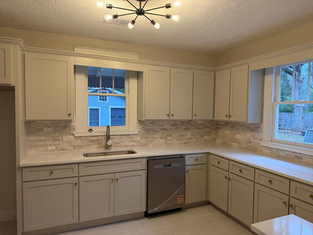 1432 22nd Street Columbus, GA 31901 - Photo 5 of 18 a kitchen with a sink cabinets and window