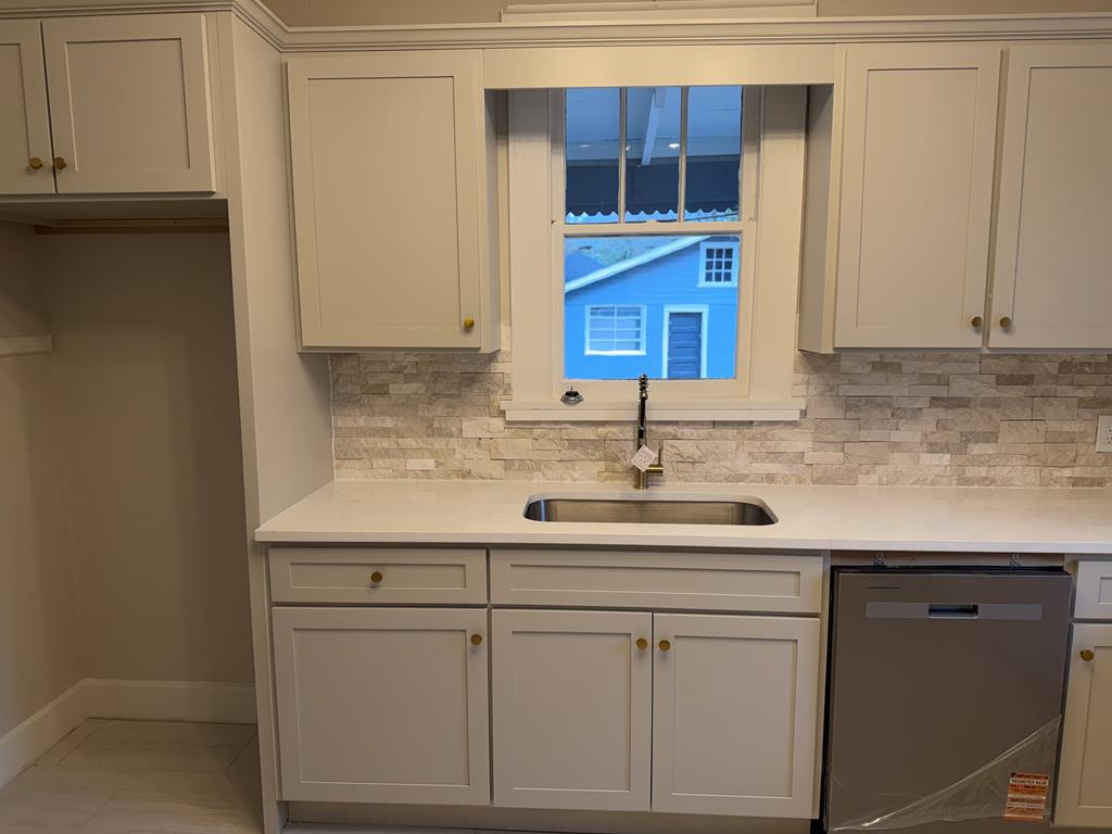 1432 22nd Street Columbus, GA 31901 - Photo 7 of 18 a kitchen with a sink and cabinets