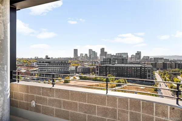 a view of a balcony with city view