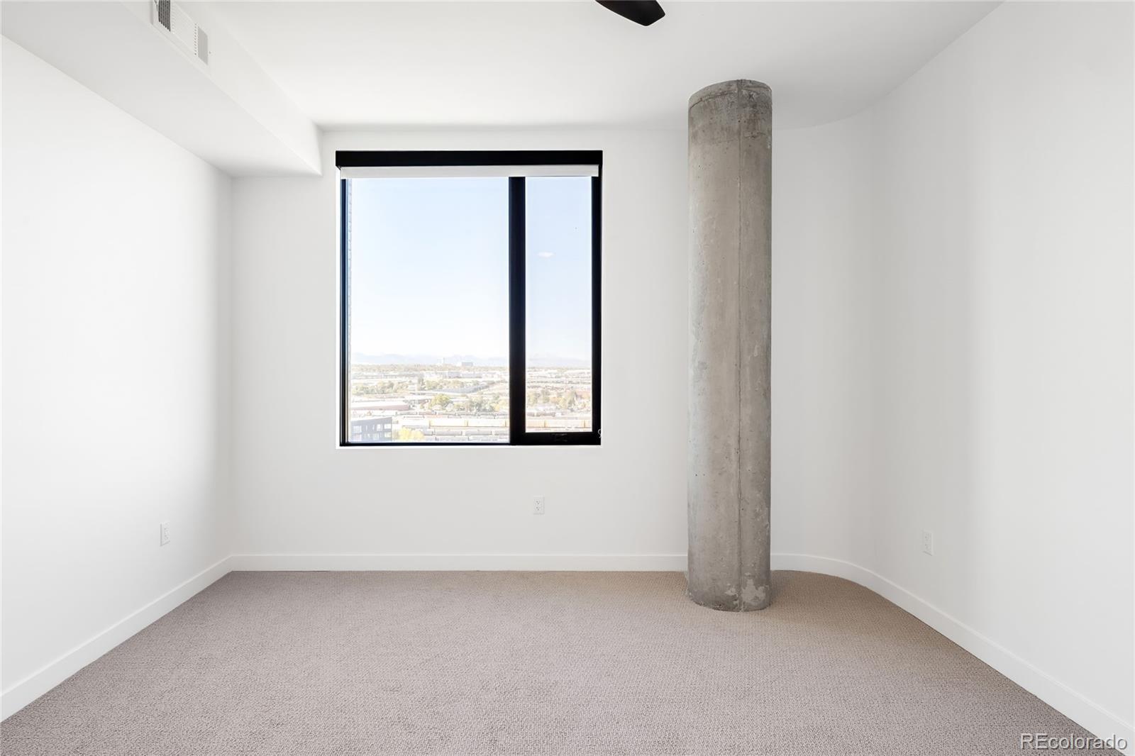 3520 Chestnut Place, Unit 1101 Denver, CO 80216 - Photo 24 of 44 an empty room with a window