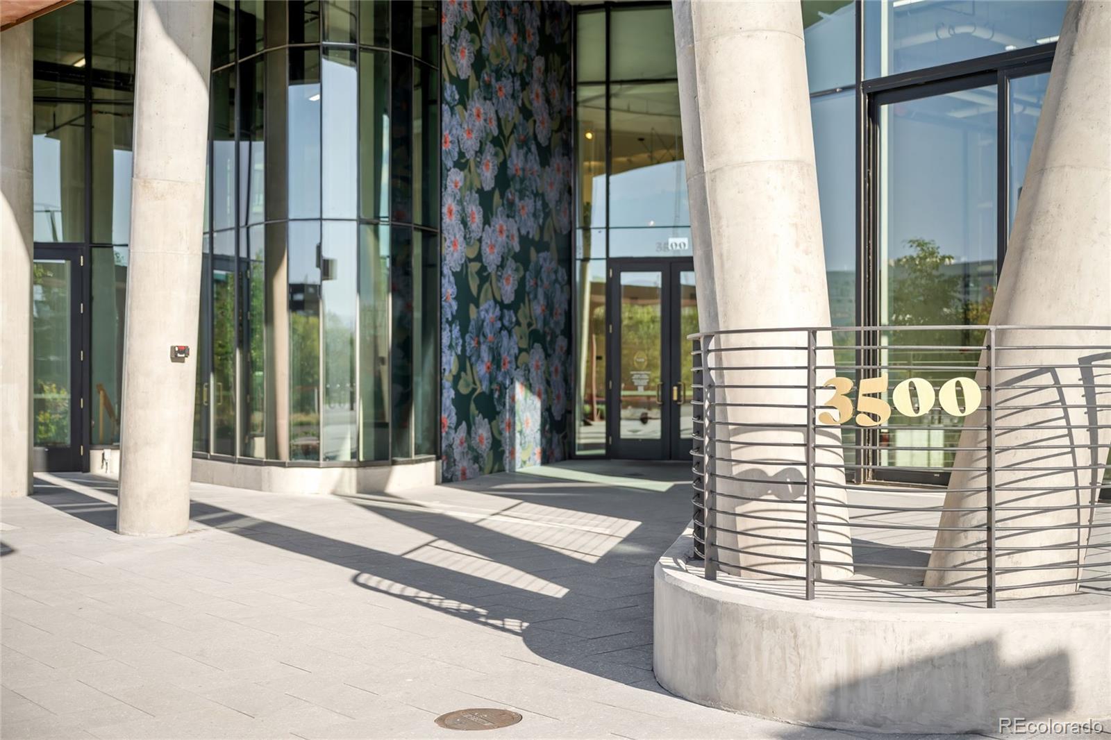 3520 Chestnut Place, Unit 1101 Denver, CO 80216 - Photo 44 of 44 a view of a building from a corridor