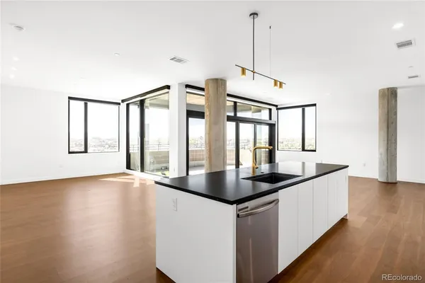 a kitchen with sink and window