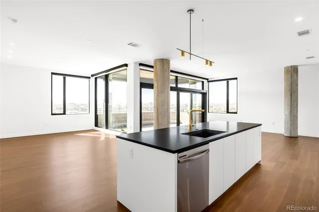 a kitchen with sink and window