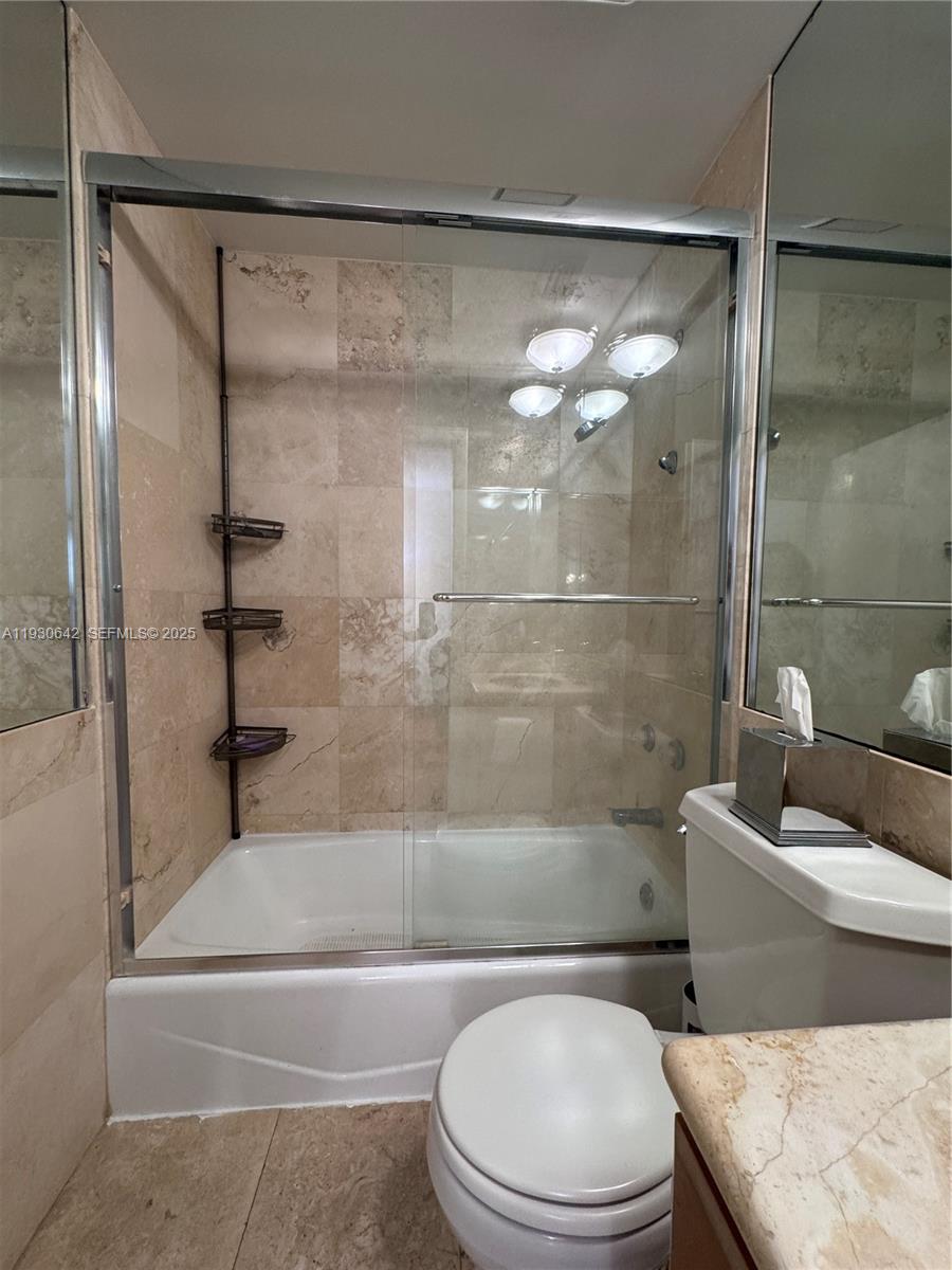 361 Collins Avenue, Unit A2 Miami Beach, FL 33139 - Photo 15 of 25 a bathroom with a toilet and a shower