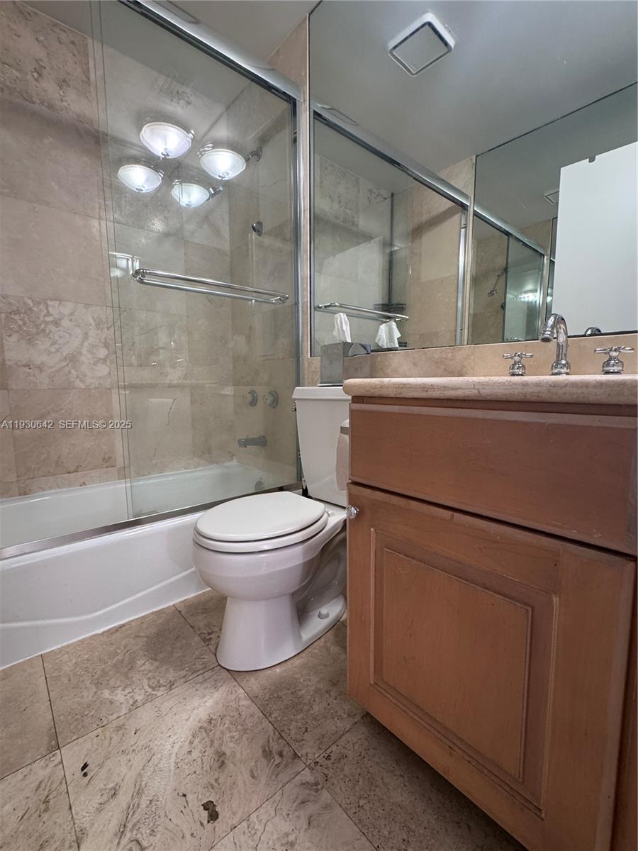361 Collins Avenue, Unit A2 Miami Beach, FL 33139 - Photo 16 of 25 a bathroom with a toilet and a shower