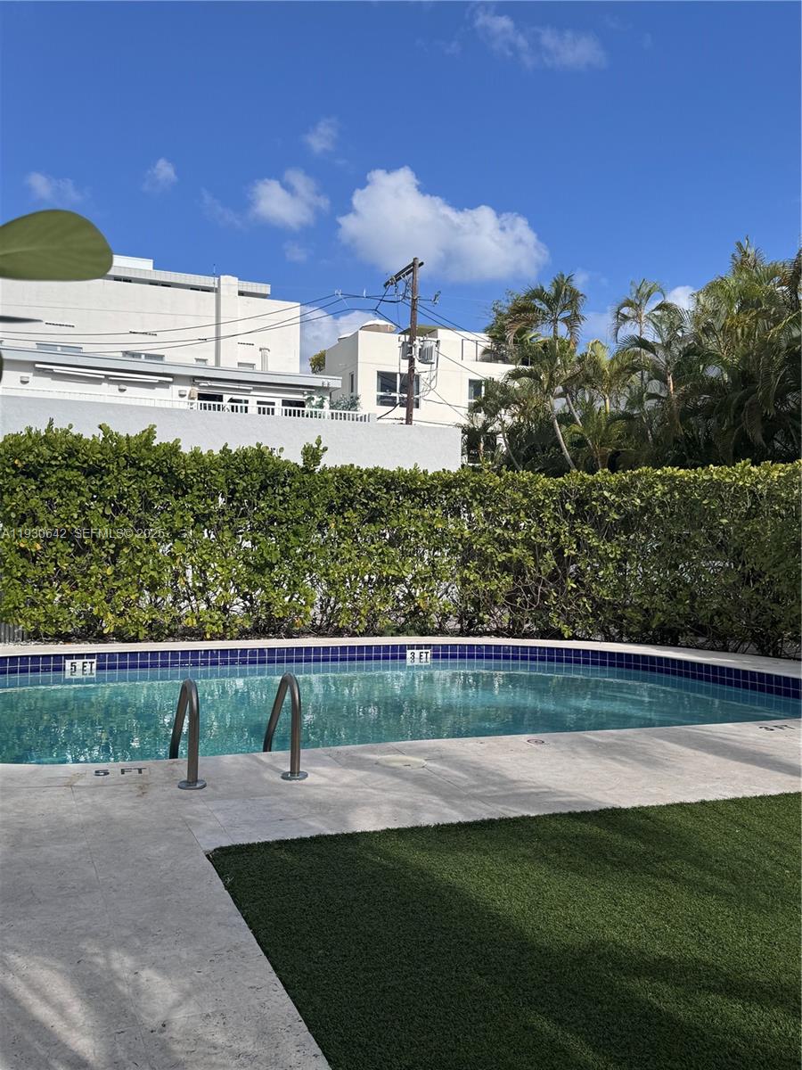 361 Collins Avenue, Unit A2 Miami Beach, FL 33139 - Photo 18 of 25 a front view of a house with a yard