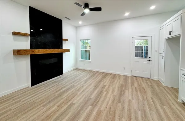 wooden floor in an empty room with a window