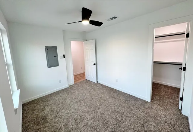 an empty room with a empty space and windows