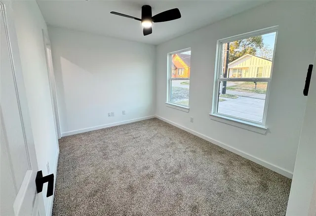 a view of an empty room and window