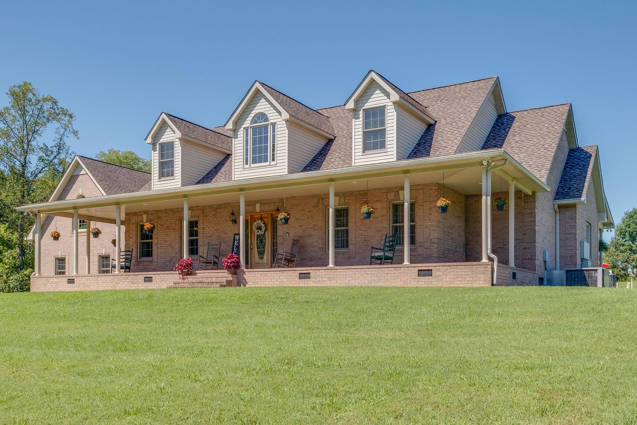 471 Penny Morris Road Portland, TN 37148 - Photo 1 of 33 front view of a building with a garden