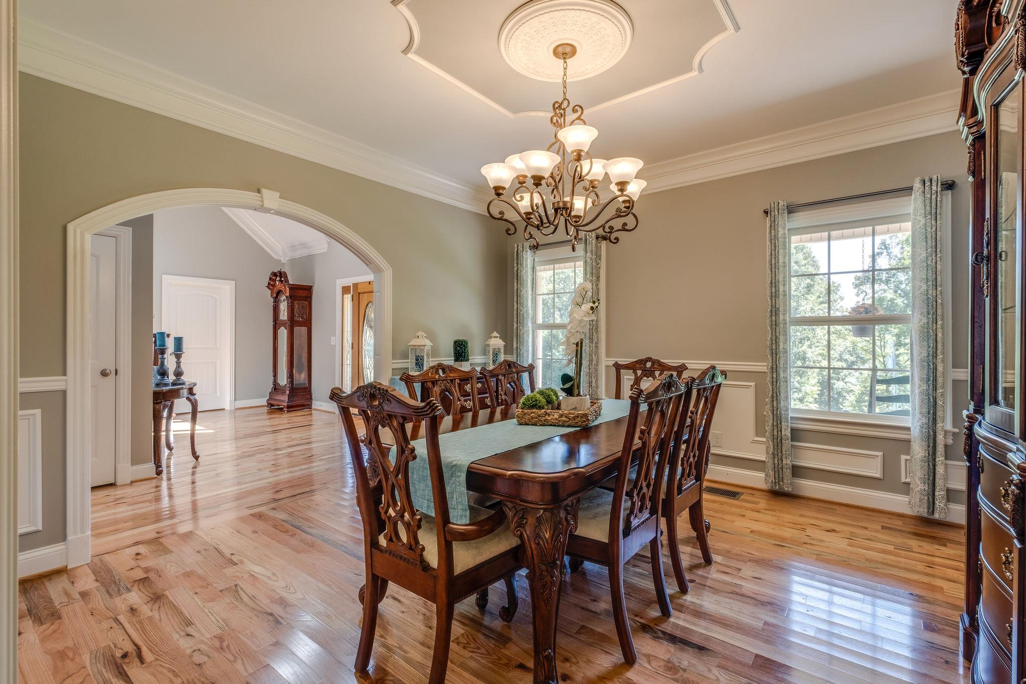 471 Penny Morris Road Portland, TN 37148 - Photo 4 of 33 a view of a dining room with furniture wooden floor and chandelier