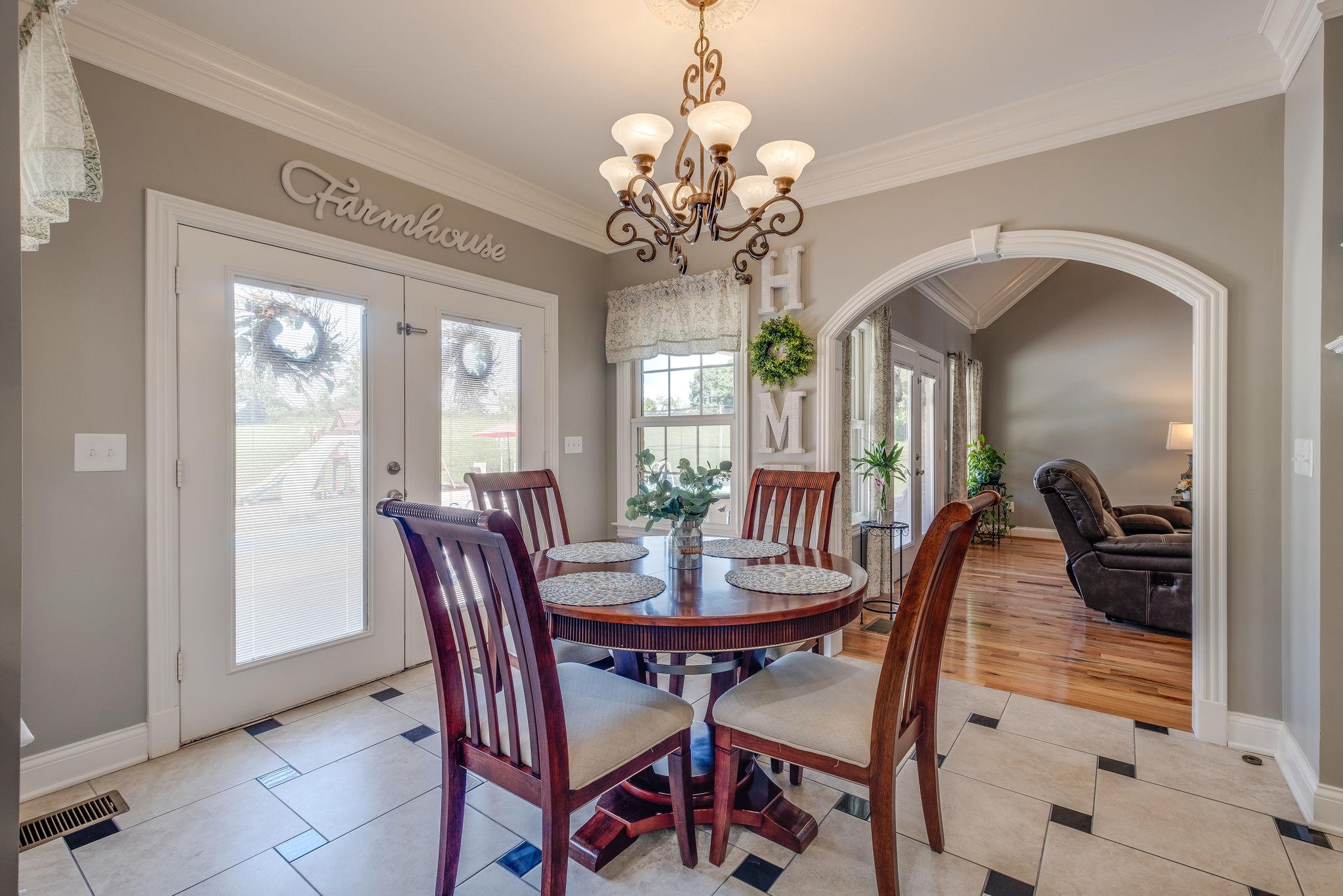 471 Penny Morris Road Portland, TN 37148 - Photo 7 of 33 a view of a dining room with furniture and a chandelier