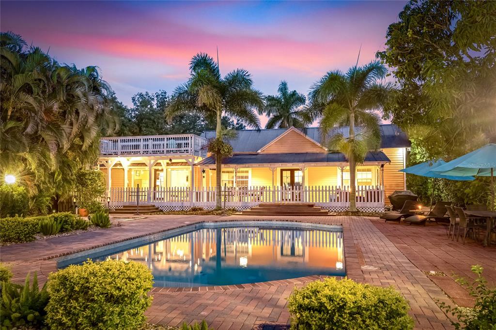 19007 Scallop Loop, Unit 204 Lakewood Ranch, FL 34211 - Photo 53 of 57 a view of a swimming pool with an outdoor seating