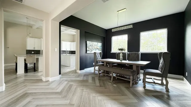 a kitchen with a sink and refrigerator