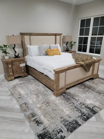 a view of a bedroom with furniture and windows