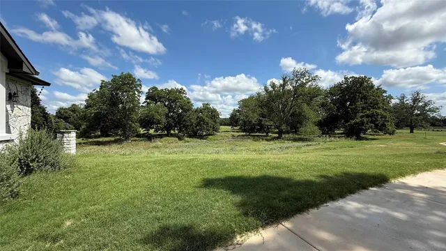 a view of outdoor space with deck and yard
