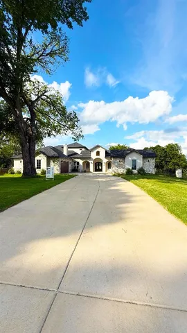 a view of yard with swimming pool and green space