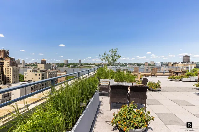 a view of a patio with couches table and chairs