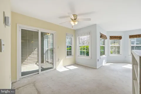 a front view of a residential apartment building with a yard