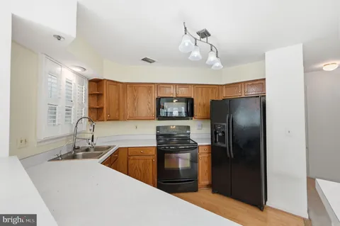 a view of a livingroom with an empty space and a fireplace