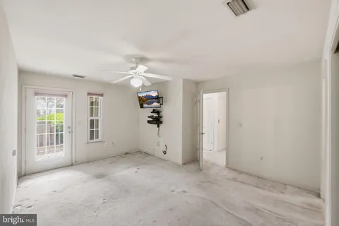 a kitchen with stainless steel appliances granite countertop a refrigerator a sink and a stove