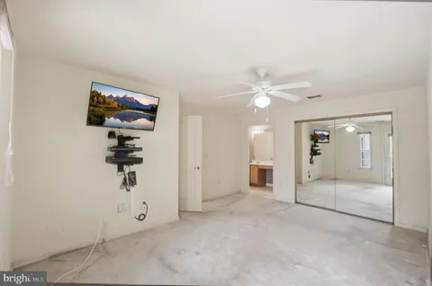 a bathroom with a shower and a sink