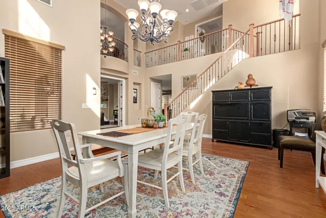 a dining room with a table and chairs